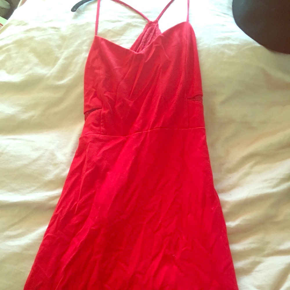 Tea-length red party dress.